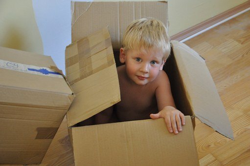 child in a moving box