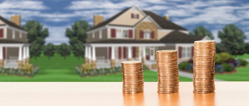 Stacked coins in front of the house