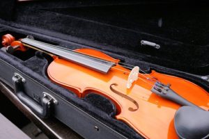 a violin in a hard black case