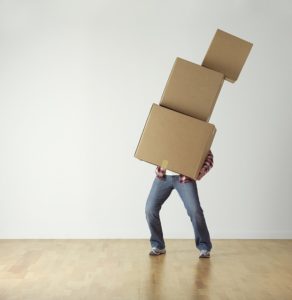 A person holding boxes
