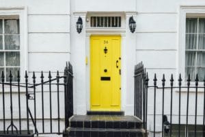 renovating your home on a budget - New yellow front door