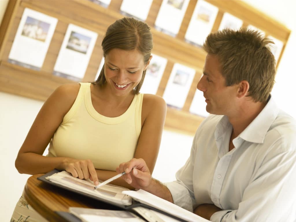 Man showing paper to a woman